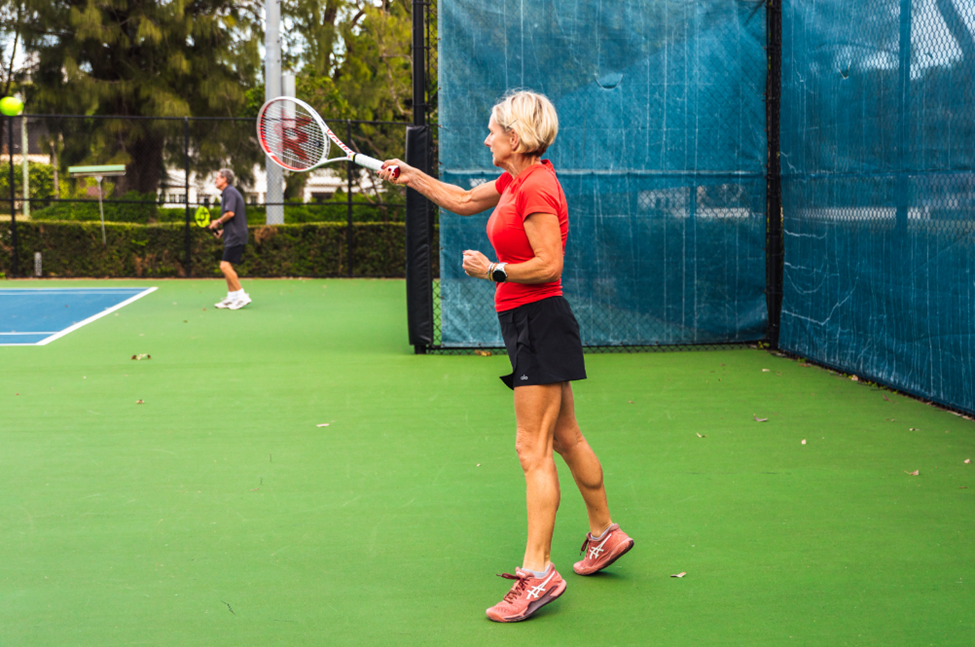A woman holding a tennis racquet