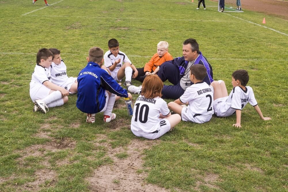Coach with team